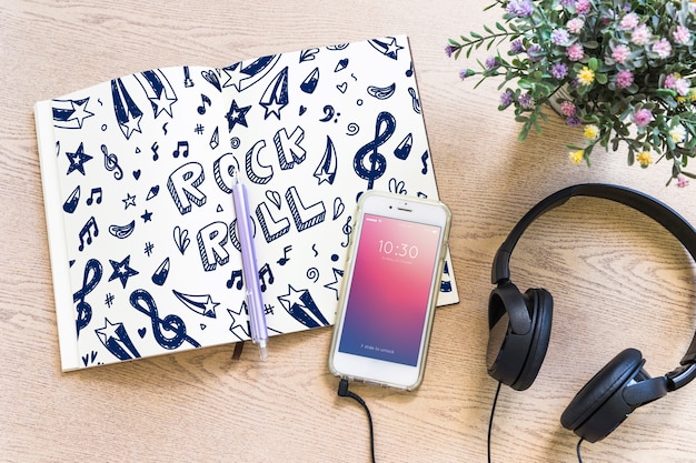 PSD music mockup with headphones and smartphone