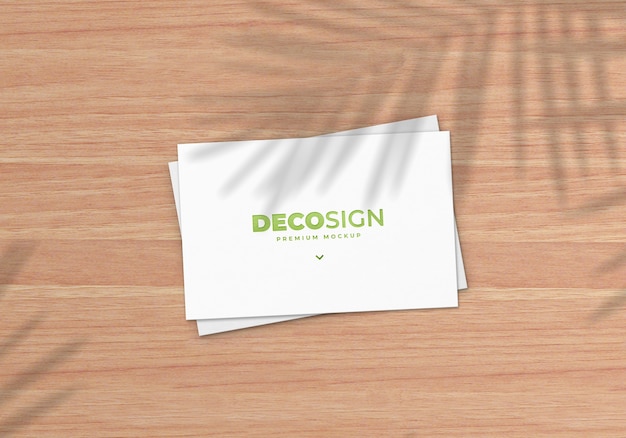 Natural business card mockup on wooden table