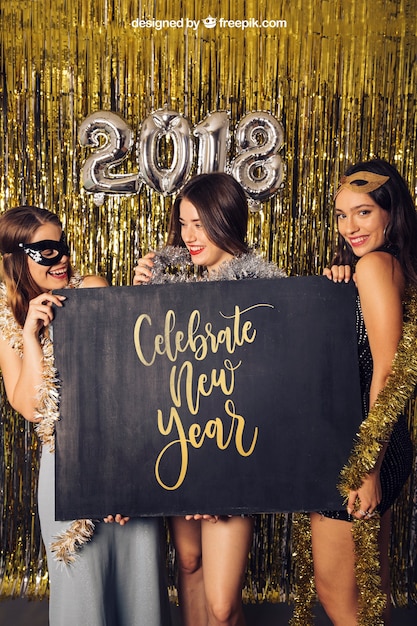 New year mockup with three girls showing board