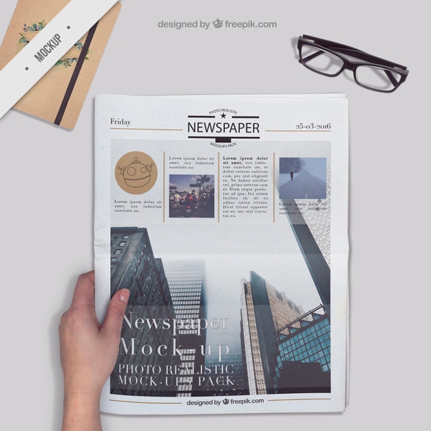 PSD newspaper on a desktop with agenda and glasses