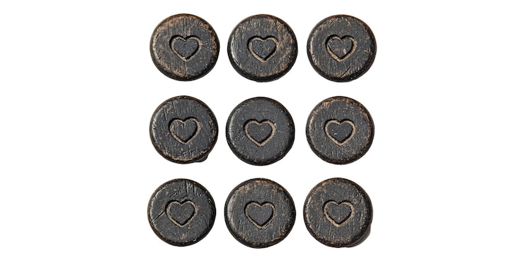 PSD nine vintage wooden buttons with heart design isolated on transparent background