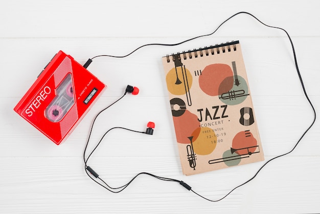 Notebook beside music cassette