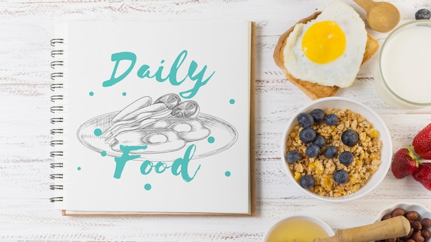 Notebook mockup with breakfast concept