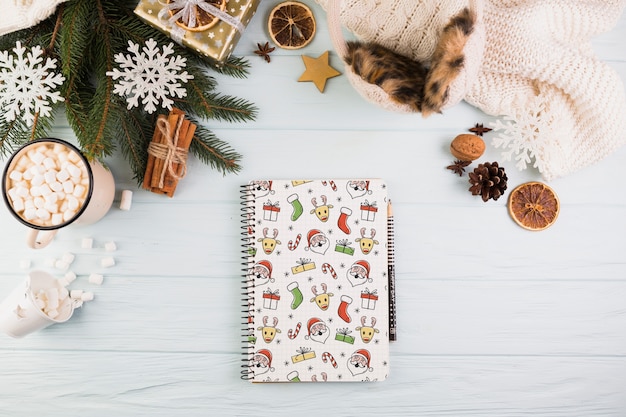 Notebook mockup with christmas decoration