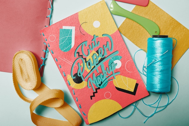 PSD notebook mockup with cut paper