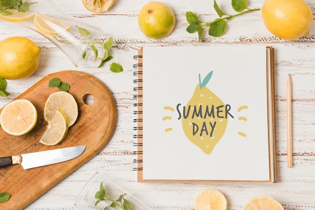 Notebook mockup with lemons for summer drink