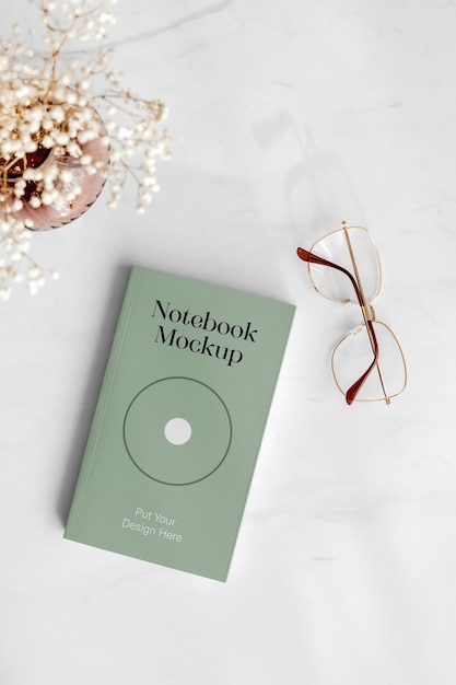 PSD notebook with glasses mockup