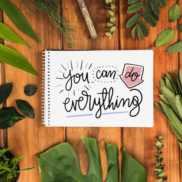 notepad mockup with tropical leaves