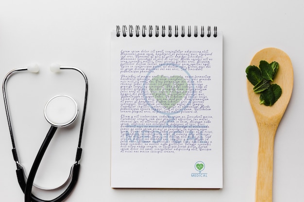 notepad with mint leaves top view