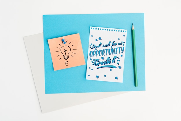 PSD notepad with motivational quote flat lay