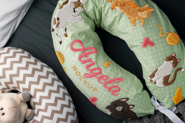 PSD nursing pillow mockup for newborns with animals print design