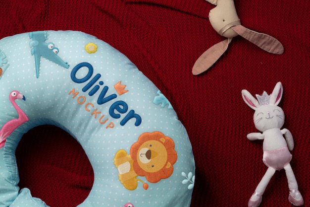 PSD nursing pillow mockup for newborns with animals print design