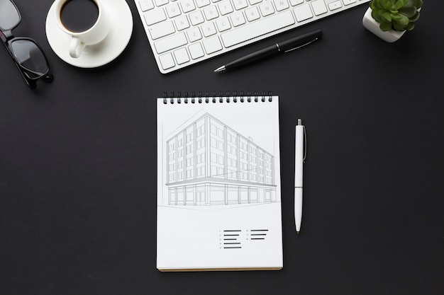 Office desk with keyboard, coffee and notebook mock-up