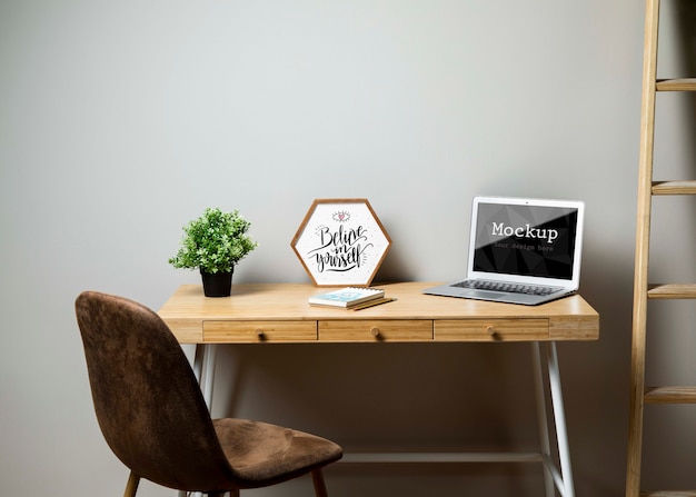 Office with laptop and ladder