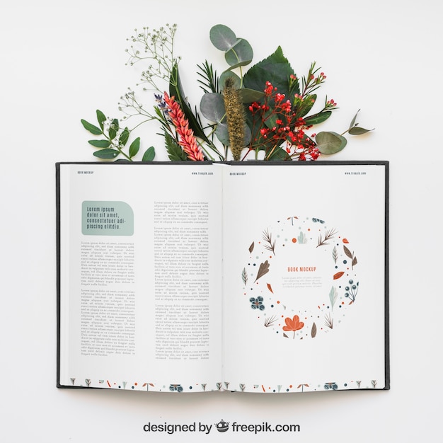 Open book mockup with leaves