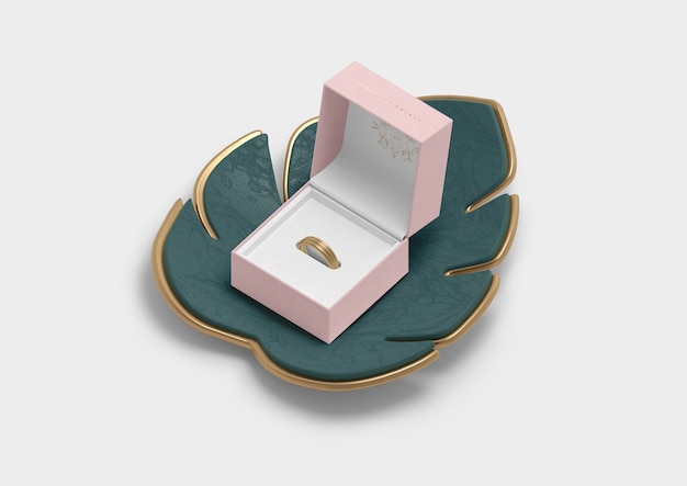 Opened jewellery box for ring and monstera leaf