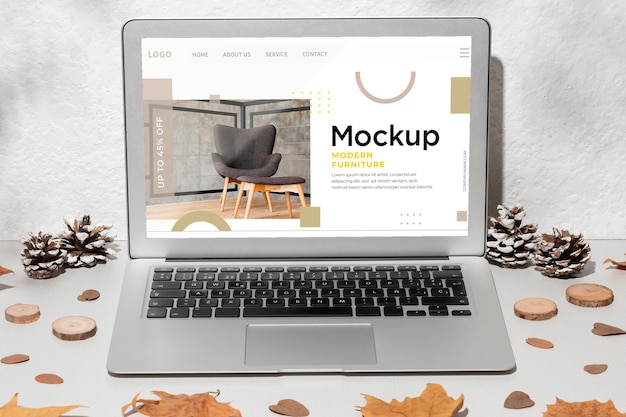 Opened laptop mockup on the table surrounded by autumn leaves