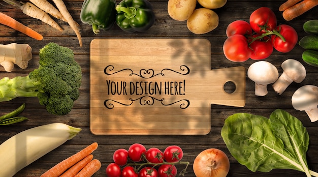 organic vegetables positioned around wooden board, top view mockup