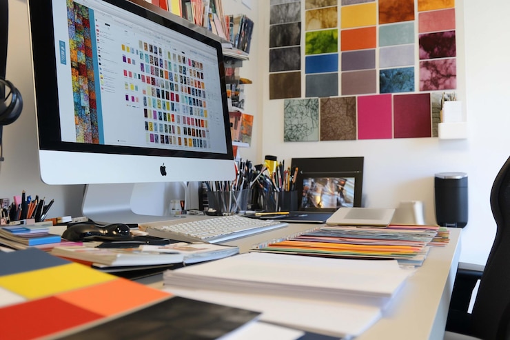 PSD organized designer workspace with computer color swatches and design materials