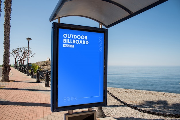 outdoor billboard close to the beach