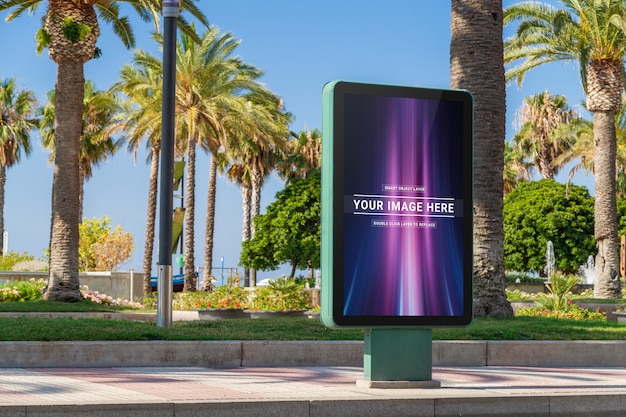 Outdoor billboard in seaside resort city mockup