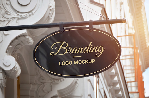 Oval shape traditional signage logo mockup in old city center