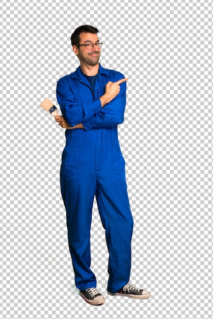 Painter man pointing to the side to present a product