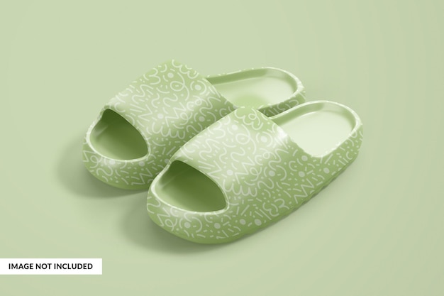 A pair of green slippers with the word 