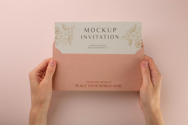 PSD paper invitation mock-up held by hands