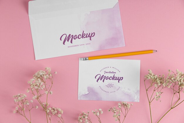 Paper invitation mock-up with watercolor design and flowers