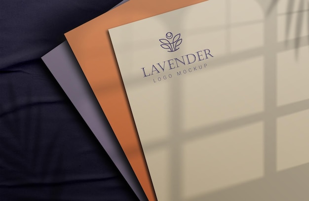 paper logo mockup with realistic shades of different colors covering the paper.logo mockup luxury