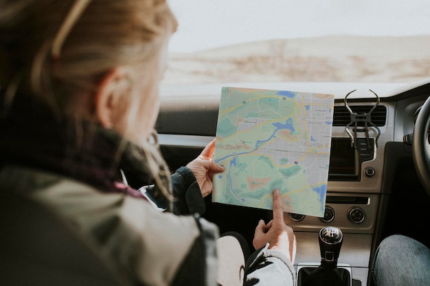 paper map mockup psd held by a senior tourist