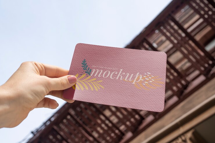 Premium PSD | Paper mockup design held in hand