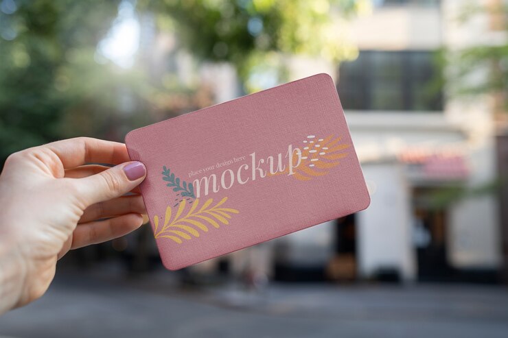 Premium PSD | Paper mockup design held in hand