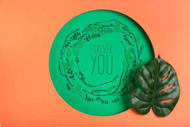paper shape with realistic leaf beside