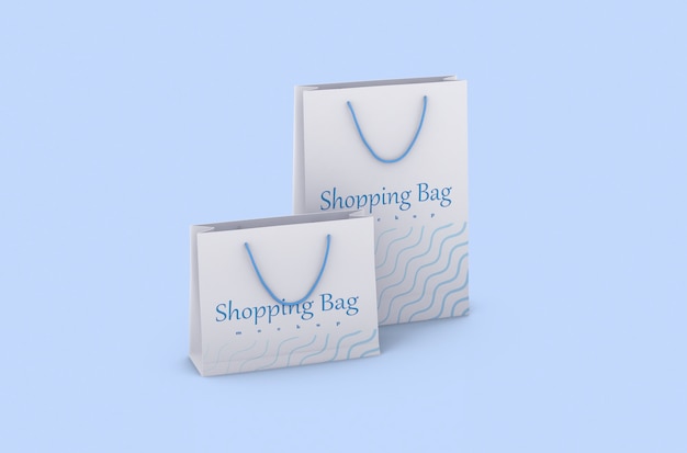 ブランディングとコーポレートアイデンティティのための孤立したモックアップをロープハンドル付きの紙のショッピングパッケージ