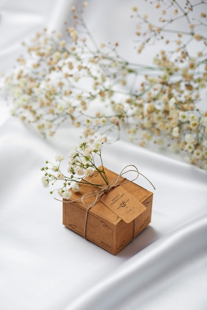 PSD paper wrapped wedding gift box with baby's breath flowers