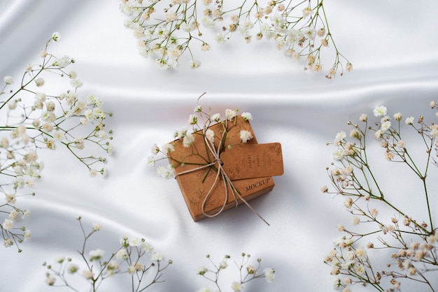 PSD paper wrapped wedding gift box with baby's breath flowers