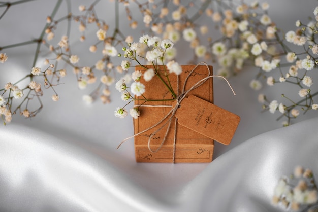 PSD paper wrapped wedding gift box with baby's breath flowers