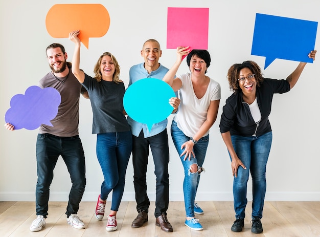 People carrying speech bubble icons