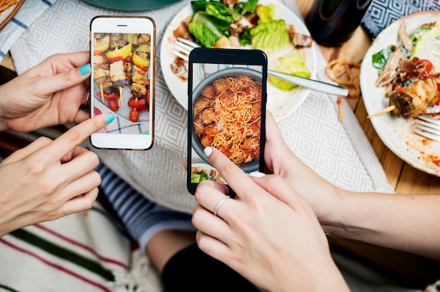 PSD people sharing food photos on mobile phone