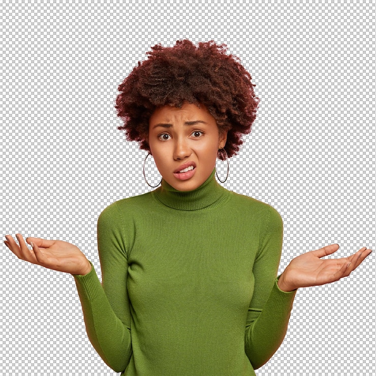 PSD people and uncertainty concept displeased hesitant female model spreads palms with doubt looks confusingly wears green sweater poses against pink wall copy space upwards