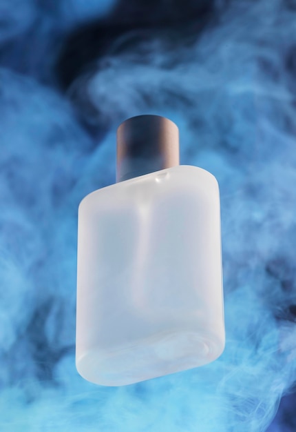 Perfume bottle and blue smoke