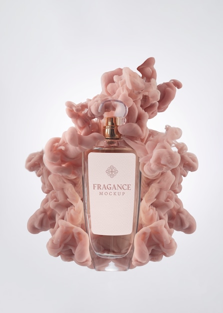 Bottiglia di profumo e mockup di fumo rosa