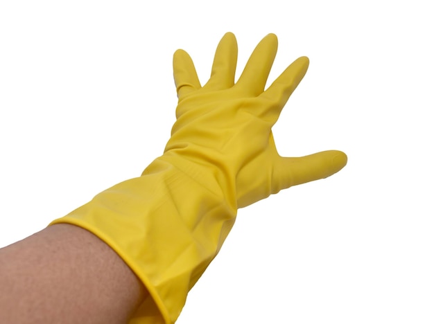 Person hand wearing yellow rubber glove reaching spreading fingers cut out isolated on white