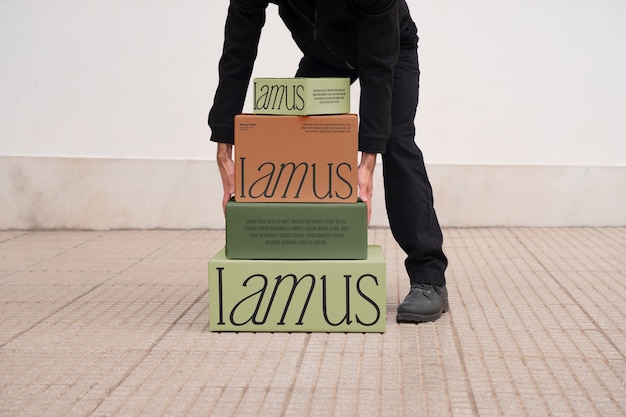 Person holding boxes mockup