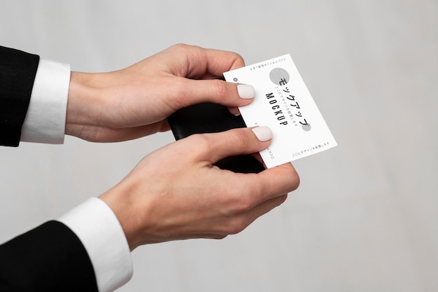 PSD person holding a business card mock-up