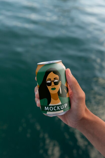 Person holding can mockup