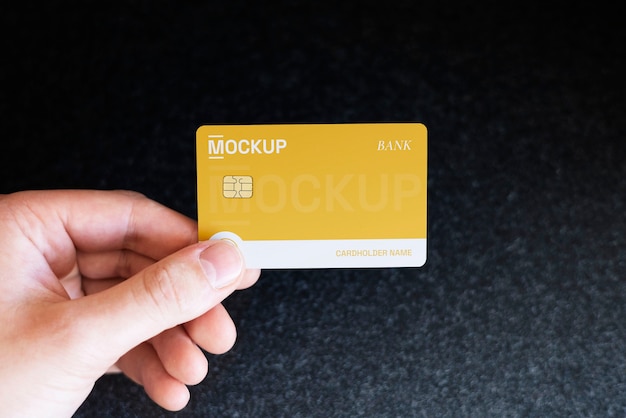 PSD person holding credit card mock-up in hand