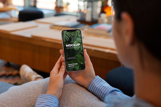 Person holding a device mockup